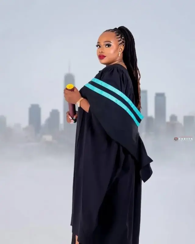 Graduation photoshoot with scroll and gown